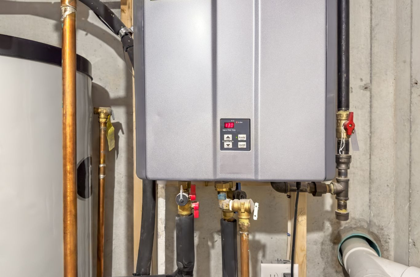 Tankless heater and copper piping, illustrating Water Heater Installation in Wells, ME by Wanda’s Water Heaters.