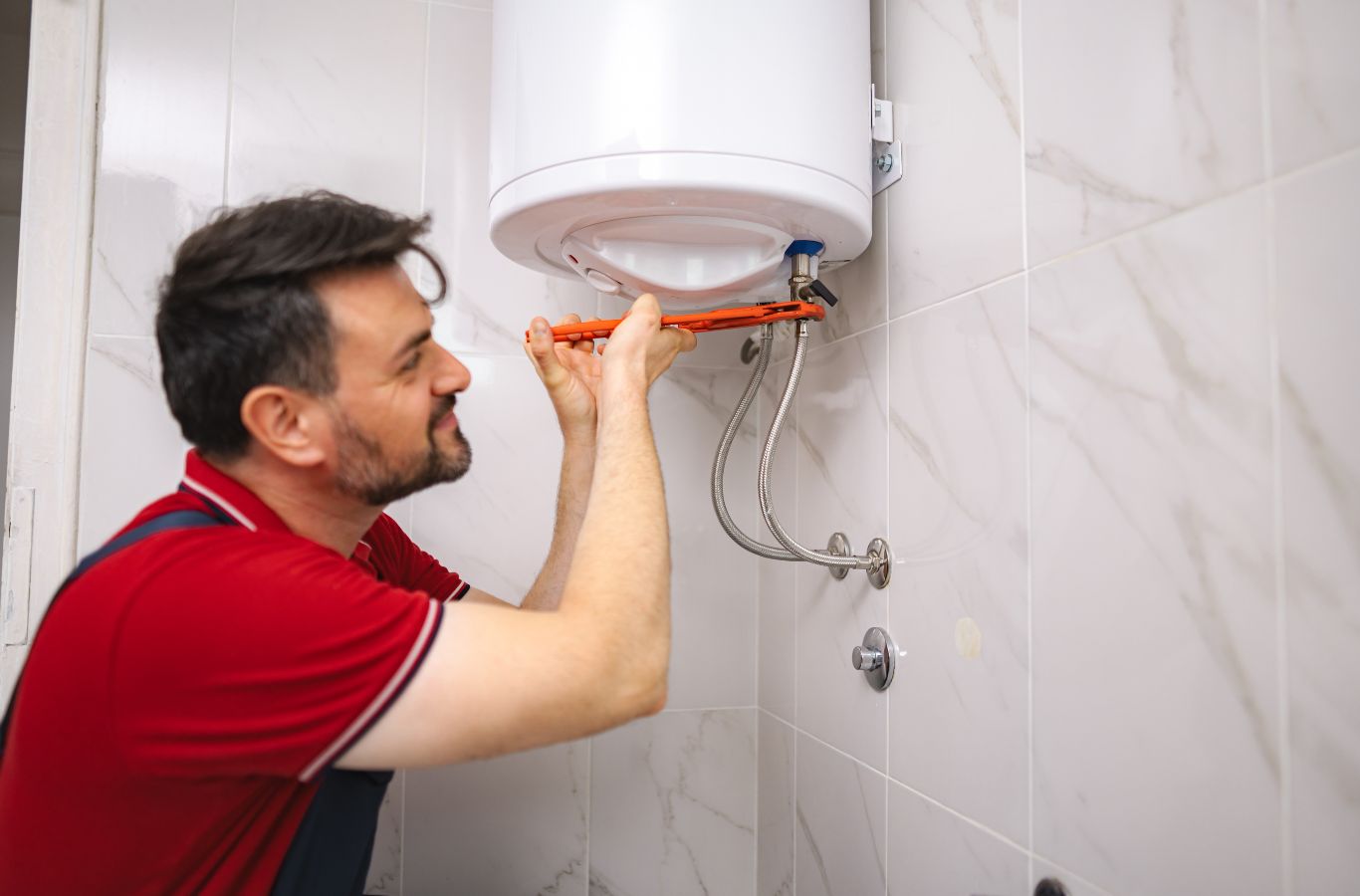 Tank connections being adjusted, shown for Wanda’s Water Heaters in Sanford, ME. Water Heater Installation Near Me.